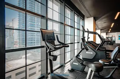 a gym with two exercise bikes in a room with windows at Apartment in New Luxury Condo in Downtown in Miami