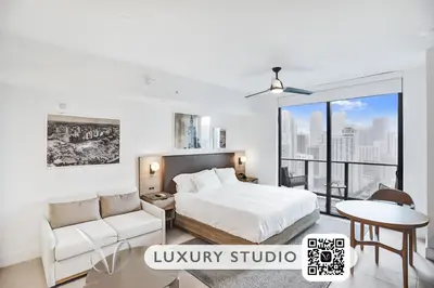 a bedroom with a bed and a couch and a table at La Terrasse by VIAC - Luxury Bay View Studio with Balcony 29th Floor Miami in Miami