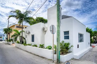 a white building with a stop sign on a street at Casa Roselle # 1 in Hollywood