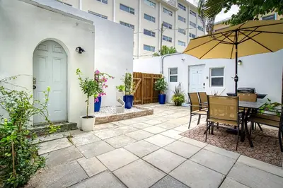 a patio with a table and an umbrella at Casa Roselle # 3 in Hollywood