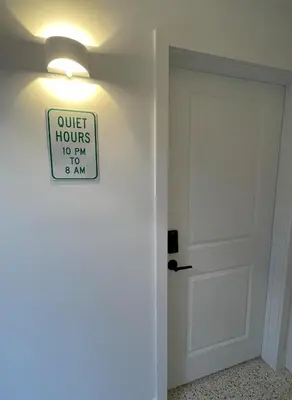 a sign on a wall next to a door at Newly Remodeled full Apartment in Miami