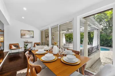 a dining room with a table and chairs at Miami Hidden Garden by TilahStays in Miami