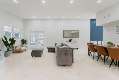 a living room with a couch and chairs at Beautiful Aventura Villa Sleeps 26 in Miami