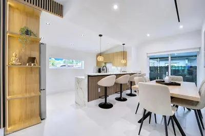 a kitchen and dining room with a table and chairs at The Rock & Rhythm Villa Miami Downtown - Playground,Mini Golf, BBQ, Garden Relaxation in Miami