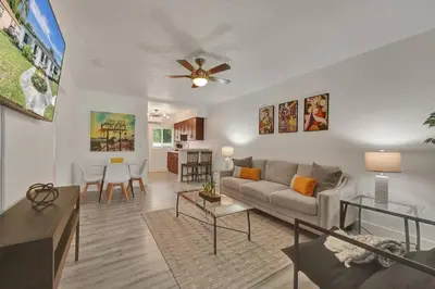 a living room with a couch and a table at Explorer's Retreat Villa in Miami