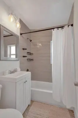 a bathroom with a tub and a sink and a shower at Explorer's Retreat Villa in Miami