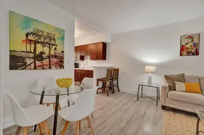 a living room with a table and a couch at Explorer's Retreat Villa in Miami