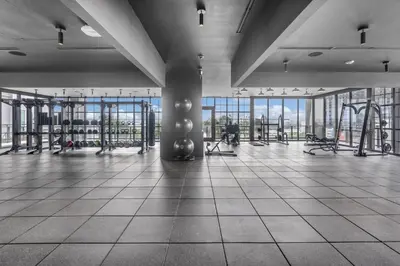 a gym with swings and machines in a building at Stylish City Getaway with Pool Skyline Views in Miami