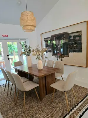a dining room with a wooden table and chairs at Sunset Retreat at Heart of Miami with pool in Miami