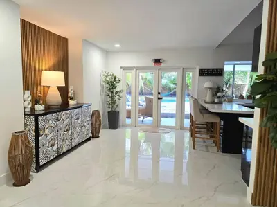 a living room with a kitchen and a dining room at Sunset Retreat at Heart of Miami with pool in Miami