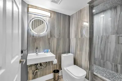 a bathroom with a toilet and a sink at Fantastic Townhouse Beach Access Resort Amenities! in Hallandale Beach