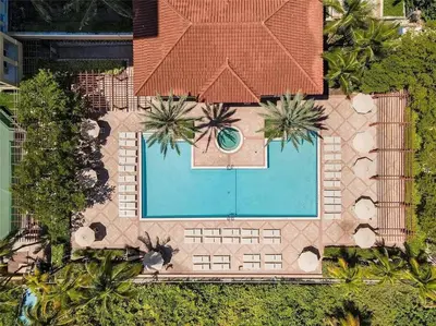 an overhead view of a swimming pool with a house at Fantastic Townhouse Beach Access Resort Amenities! in Hallandale Beach