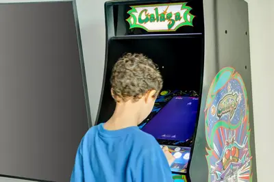 a young boy playing a video game with a skateboard at Fall in love with Brickell - Your Miami home in Miami