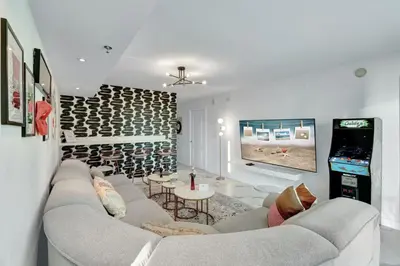 a living room with a couch and a flat screen tv at Fall in love with Brickell - Your Miami home in Miami