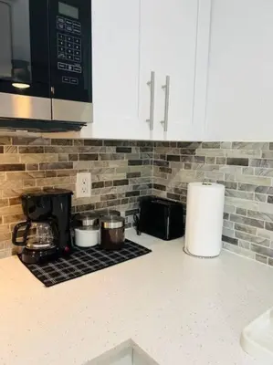 a kitchen counter with pots and pans on a stove at Sunshine Cove in Lake Forest