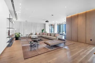 a living room with a couch and a table at Sky-High Views Pool and Fitness Center Access in Miami