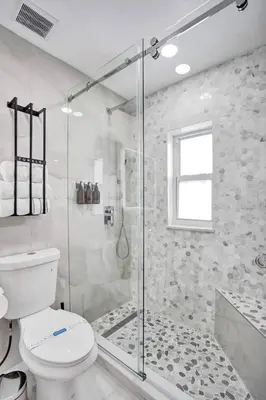 a bathroom with a toilet and a glass shower at Hollywood Lux Retreat in Hollywood