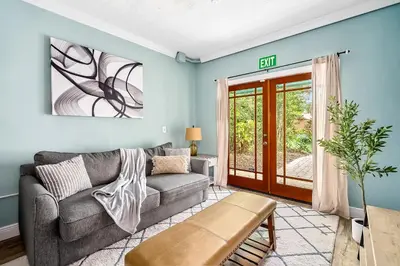 a living room with a couch and a window at 3-Bedroom Villa with Heated Pool and Tropical Yard in Hollywood Lakes in Hollywood