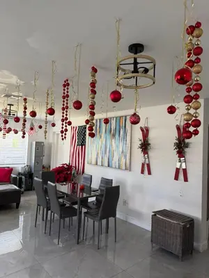 a dining room with a table and chairs and christmas decorations at HOSTEL Star in Hallandale Beach