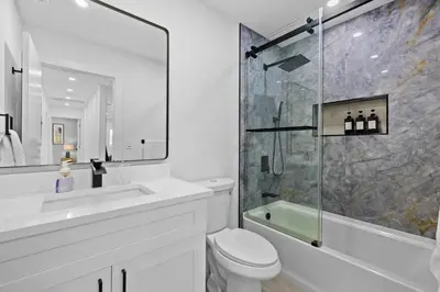 a bathroom with a sink toilet and a shower at Spacious 4BR Waterfront Home with Private Pool, Tiki Hut & Free Parking near Miami & Key Largo in Cutler Bay