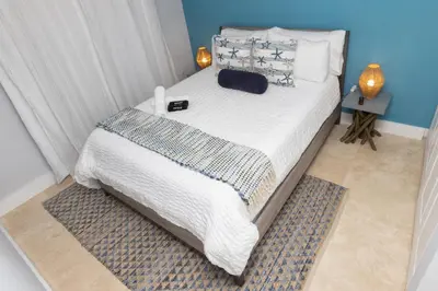 a bedroom with a large bed with white sheets and pillows at Casa Bora Bora - Fun in Miami - Big Pool - Fit 12 in Miami