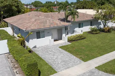 a house with a tile roof at Casa Bora Bora - Fun in Miami - Big Pool - Fit 12 in Miami