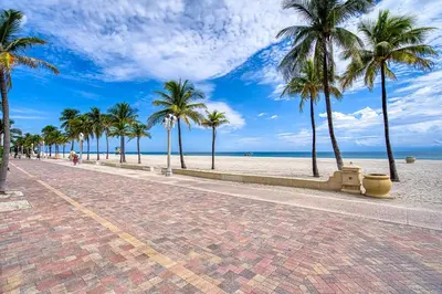 a brick street with palm trees on the beach at Casa Roselle On The Beach Full 22 in Hollywood