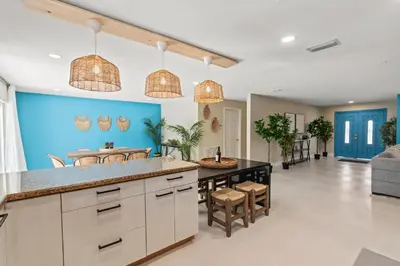 a kitchen with a large island in a room at Casa Maldivas - Blue Oasis - Heated Pool in Tamiami