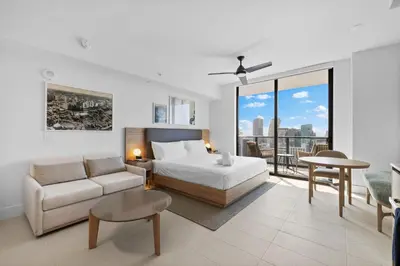 a bedroom with a bed and a couch and a table at Luxury Studio on 47th! Floor in Downtown Miami in Miami