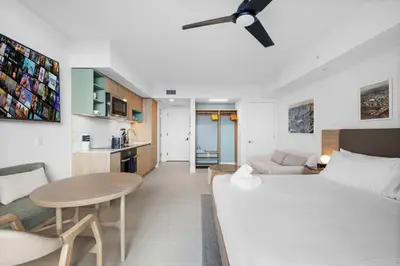 a living room with a white couch and a table at Luxury Studio on 47th! Floor in Downtown Miami in Miami