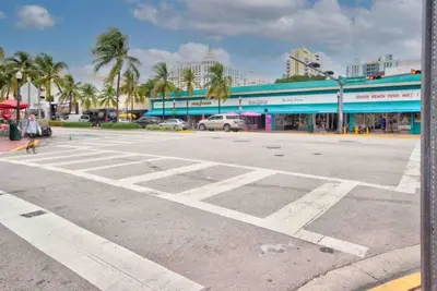 an empty parking lot in front of a store at TROPICAL HAVEN POOL & 2BLOCKS TO BEACh in Miami Beach