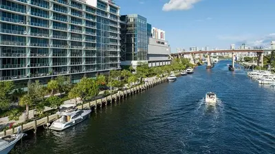 a boat in a river in a city with buildings at 5 Star Feel in Miami Prime Location in Miami