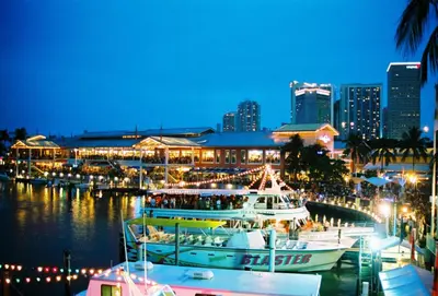 a group of boats docked at a marina at night at Artful Luxury in Miami Most Iconic Spot in Miami