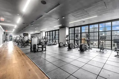 a gym with treadmills and exercise equipment in a building at Trendy Escape with Pool Gym 24th-Floor Views in Miami