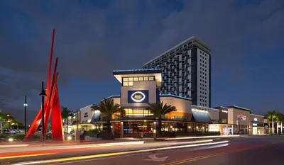 a large building on a city street at night at Doral Pool 1407 by WaveProperties in Miami