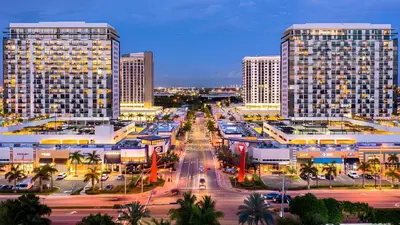a city with tall buildings and a street with cars at Doral Pool 1407 by WaveProperties in Miami