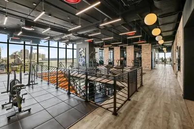 a large room with large windows and a gym at Resort-Style Living 1BR Apt in Downtown Miami in Miami