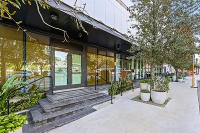 a building with stairs and plants outside of it at Resort-Style Living 1BR Apt in Downtown Miami in Miami
