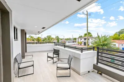 a view from the balcony of a house at April Sale! 4 BR - Private Pool, Grill, Soaking Tub, Near Coral Gables & MIA Airport in Miami