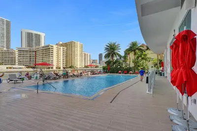 a swimming pool in the middle of a city at Beachwalk Resort in Hallandale Beach