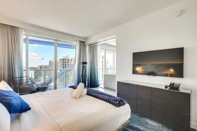 a bedroom with a large bed and a large window at Balcony with Ocean View Fort Lauderdale Oasis! in Fort Lauderdale