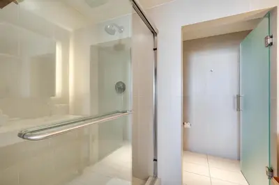 a shower with a glass door in a bathroom at Walk to Beach and Dining! Luxe Fort Lauderdale Condo in Fort Lauderdale