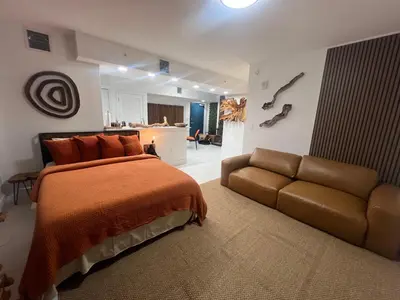 a bedroom with a bed and a couch at MONROE APART HOTEl in Hollywood