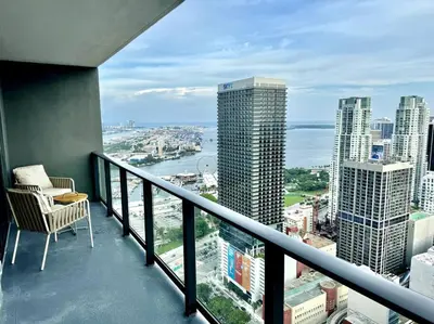 a balcony with a chair and a view of the city at 43 Floor Miami 1BD Near Arena in Miami