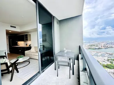 an apartment with a balcony with a view of the city at 48th Floor PH collection 1 BD Brand New Downtown in Miami