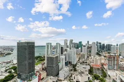 an aerial view of a city with tall buildings at Lux 48th Floor Condo, Water views, Pool, Gym and Spa in Miami