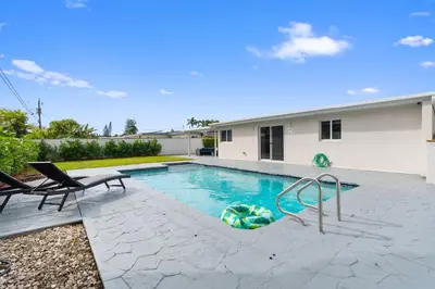 a swimming pool in the backyard of a house at Miami Japandi Style Pool - BBQ in Miami