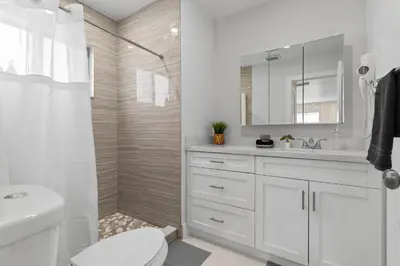 a white bathroom with a toilet and a sink at Miami Japandi Style Pool - BBQ in Miami