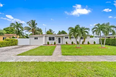 a house with palm trees in front of it at Miami Japandi Style Pool - BBQ in Miami