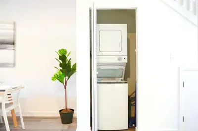 a refrigerator and a plant in a room at Entire House with Free Parking at North Miami! in Miami